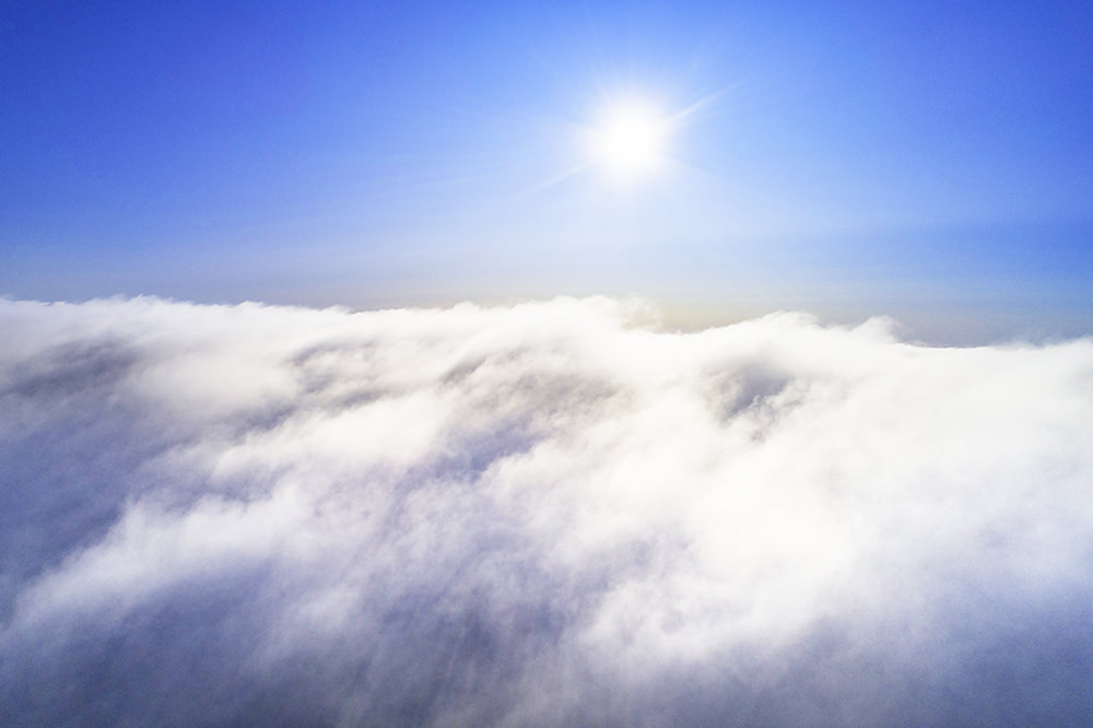 Bright Morning Sun And Clouds From Above.